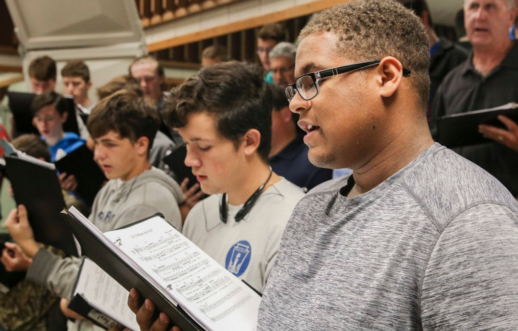 As he stands on the risers with his fellow encore studnets, junior Neo Holmes feels he will make it through districts.