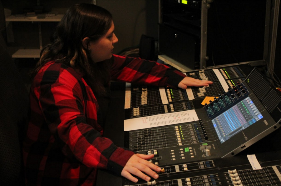 Senior Miranda Madden runs the sound booth for the upcoming show