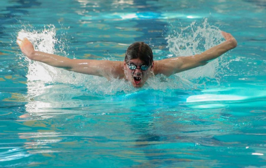 Collin Duncan practicing the butterfly stroke.