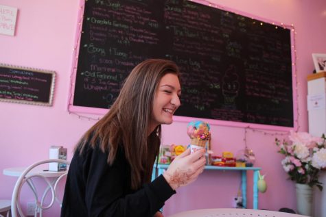 Junior Maddy Robison eats multi-flavored ice cream at Sugar Rush. 