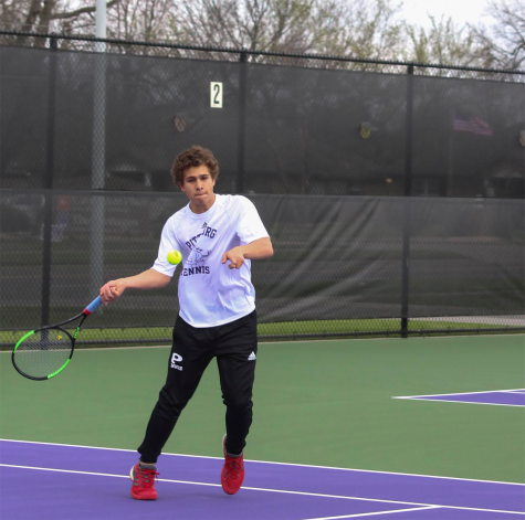 Sophomore Dakota Caudle returns a serve during his singles match against Chanute. "I think it's great that tennis is getting more publicity at PHS," Caudle said. "I'm really happy with it but I'm always looking to improve in all ways."