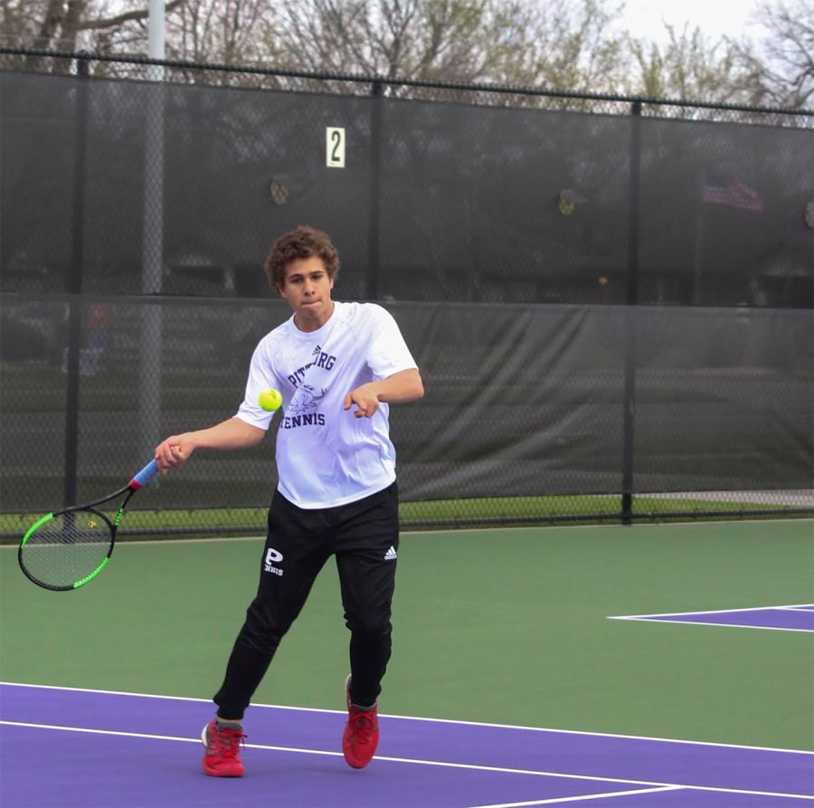 Sophomore Dakota Caudle returns a serve during his singles match against Chanute. "I think it's great that tennis is getting more publicity at PHS," Caudle said. "I'm really happy with it but I'm always looking to improve in all ways."