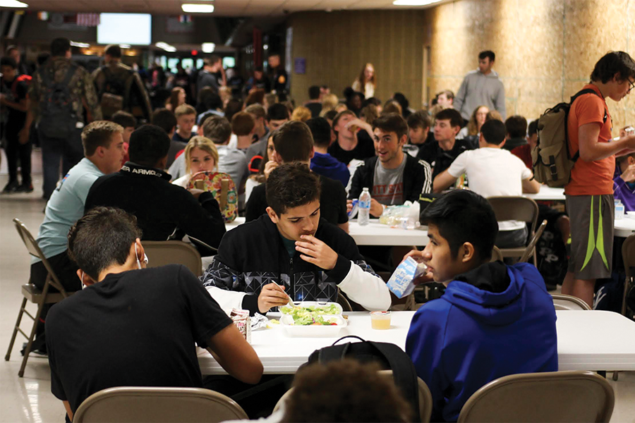 Students eat lunch at tables set up specifically for Power Hour. Students have a 50-minute break to eat lunch and meet with teachers. 