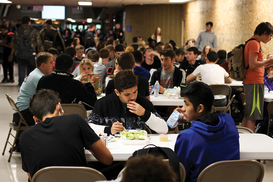Students eat lunch at tables set up specifically for Power Hour. Students have a 50-minute break to eat lunch and meet with teachers.
