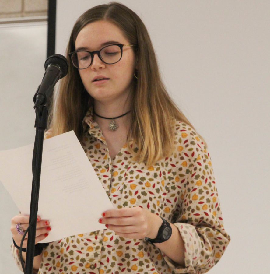 Tomasi reads a poem during her creative writing class. 