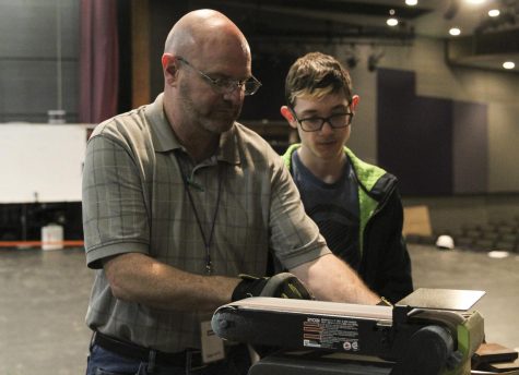 Chuck Boyles helps sophomore Cole Ingerson create a prop as a class project. While this is Boyles first year teaching a class, he has been helping behind the stage at PHS for four years. 