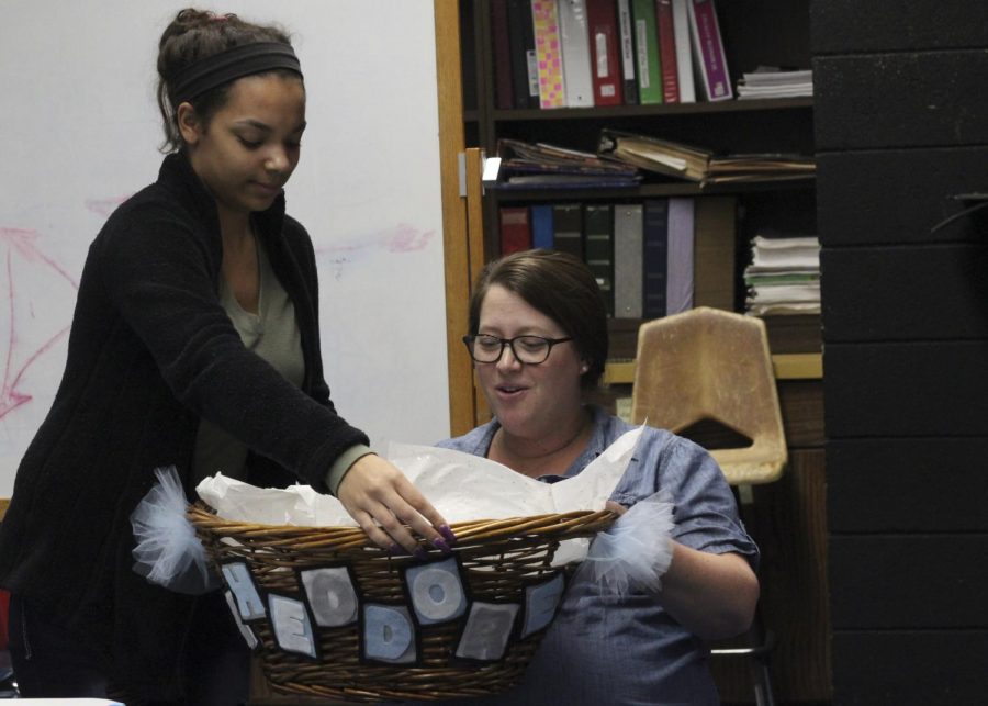 Students organize baby shower for head debate coach