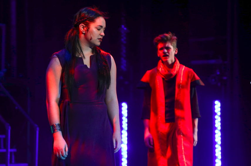 Junior McKenna Shaw stands in front of senior Aidan Harries, in the recent musical rep. show Aida