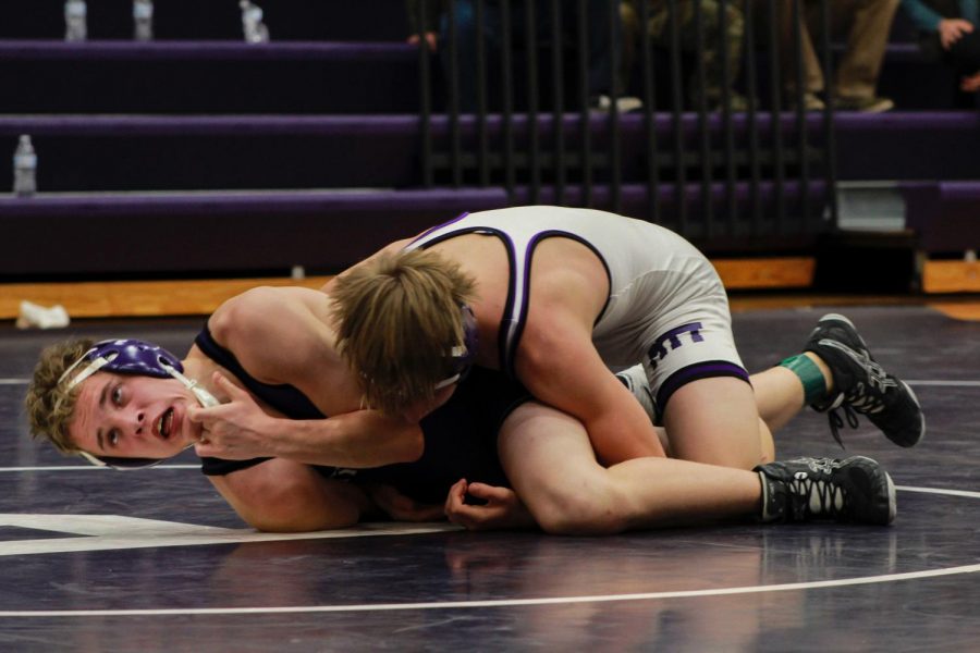 Sophomore Dalton Sutton pins down freshman Dexter Carlton at the Purple and White Wrestling Scrimmage. Sutton competed on the White Team, while Carlton competed on the Purple Team. The tournament, which kicked off the Dragon wrestlers season and determined who would be taking the teams varsity and junior varsity spots. Carlton and Sutton are two of the 16 underclassmen on the varsity team, coached by LC Davis. 