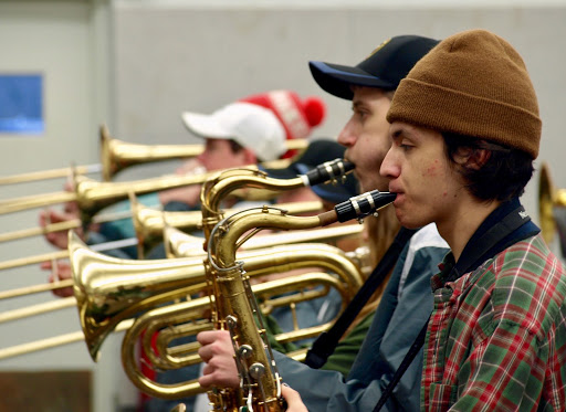 Junior Dain Reiling (right) plays next to Senior Andrew Riachi (left) at the last practice for the Mid-American All Star marching band “[I am most excited about] seeing Chicago," Riachi said. "Anytime I go to a new city I like to take it all in.”
