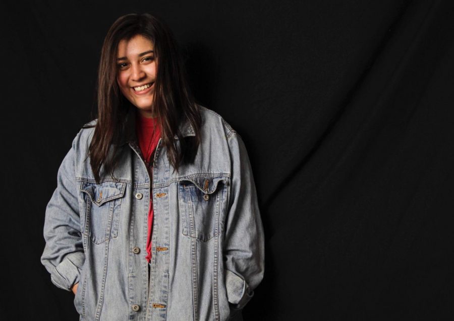 Abarca models her thrifted vintage jean jacket. Photo by Cassidy Bayliss