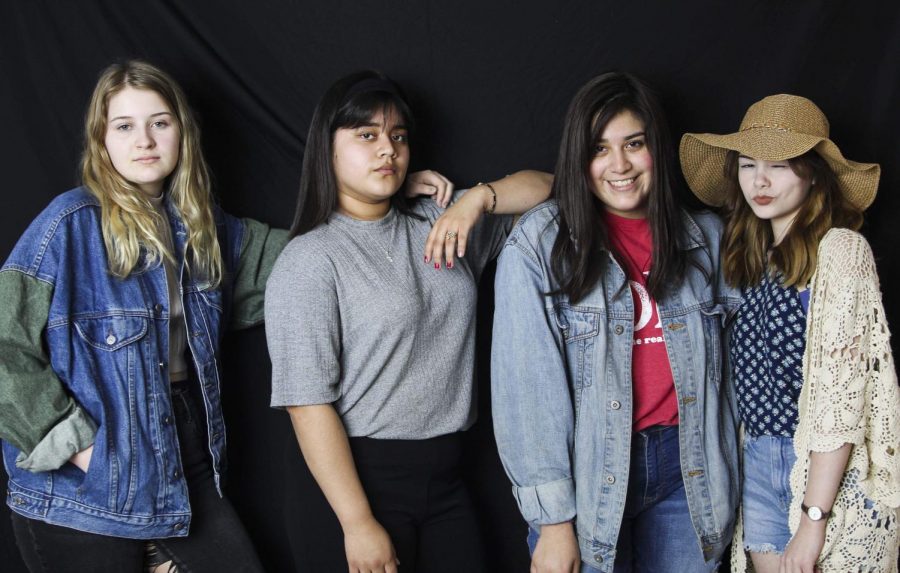 Showing off their favorite thrifted outfits sophomore Rose Scott, junior Neira Garcia, sophomore Hannah Abarca and junior Taylor Culbertson pose for the camera. 