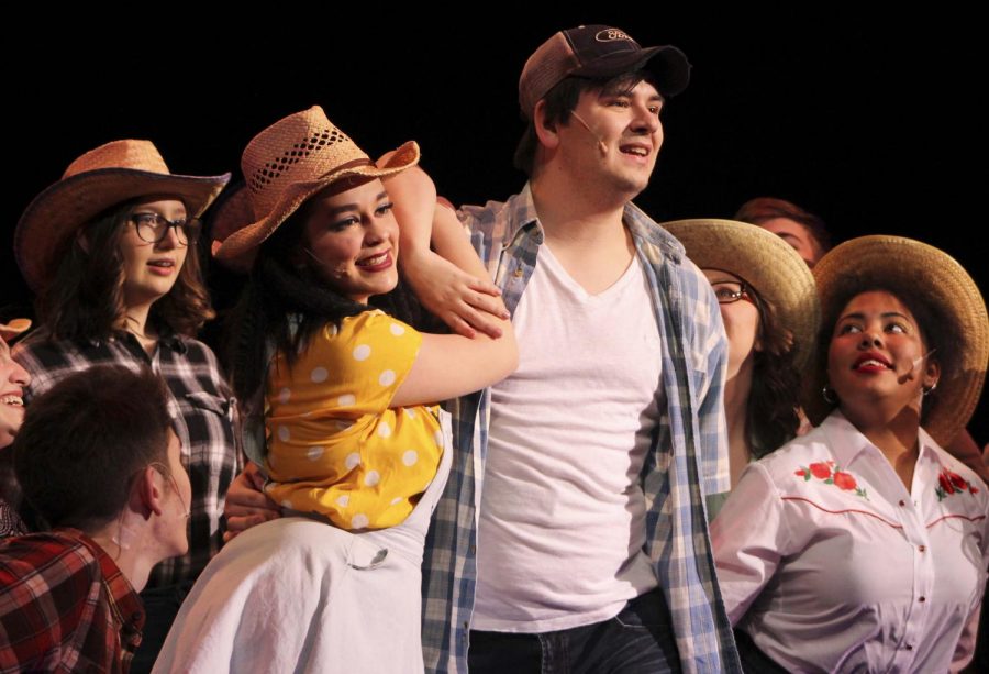 Seniors McKenna Shaw and Gabriel Anderson performing during the school play Footloose. 