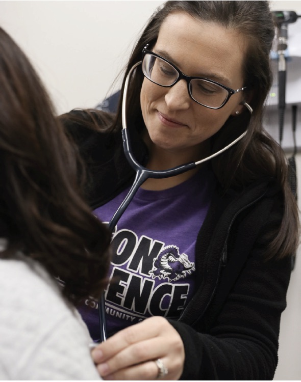 Nurse practitioner Amber Hunziker examines a student. Hunziker is now available in the clinic every day for students and staff and can even write prescriptions when necessary.