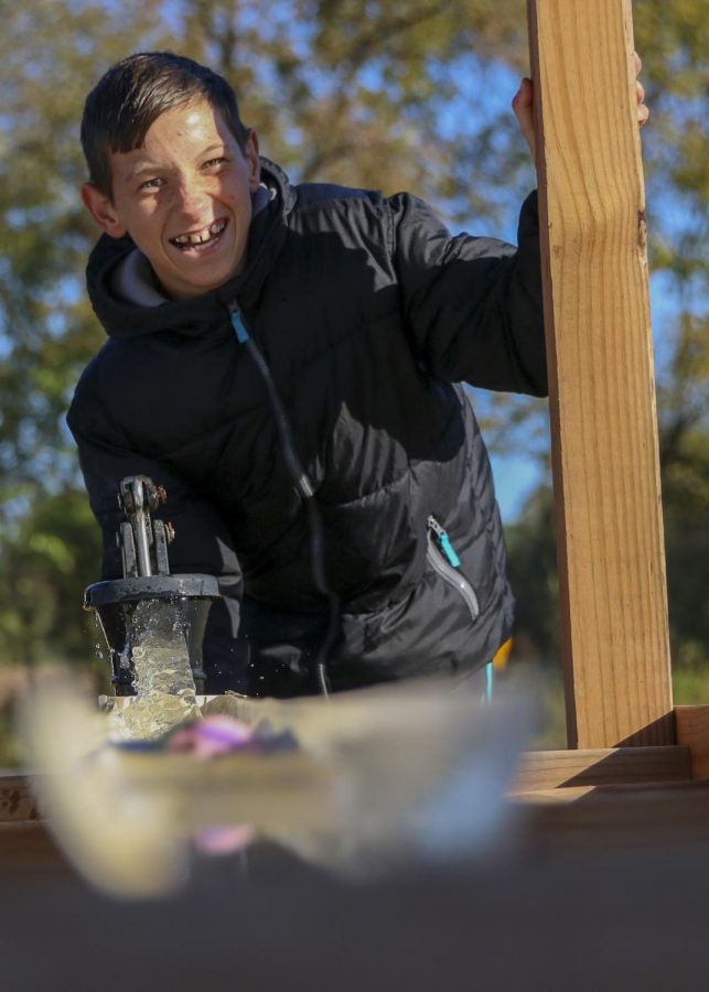 On Oct. 28, teacher Amber Kloster organized a field trip to Ol Yale Pumpkin Patch for students k-12 who have documented disabilities. Freshman Logan Johnson pumps water for the rubber duck race. According to Logans brother, senior Jorden Johnson, Logan likes to make people laugh. Logan is a one-of-a-kind kid, Jorden said. Hes really funny and tries to help anyone he can.