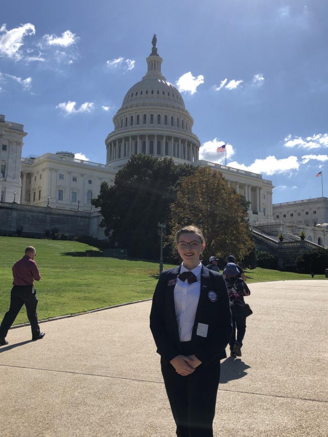 Senior+Mikayla+Kitchen+stands+in+her+HOSA+uniform+in+front+of+the+Capitol+building.+Kitchen+attended+the+conference+Sept.+19-24+after+being+invited+because+of+her+position+as+Vice+President+of+Kansas+HOSA.+