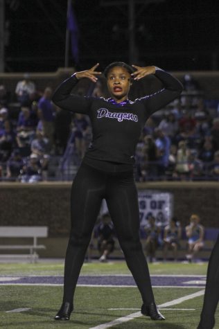 Junior I'sis Thomas dances on the halftime field during the halftime show on Oct. 19