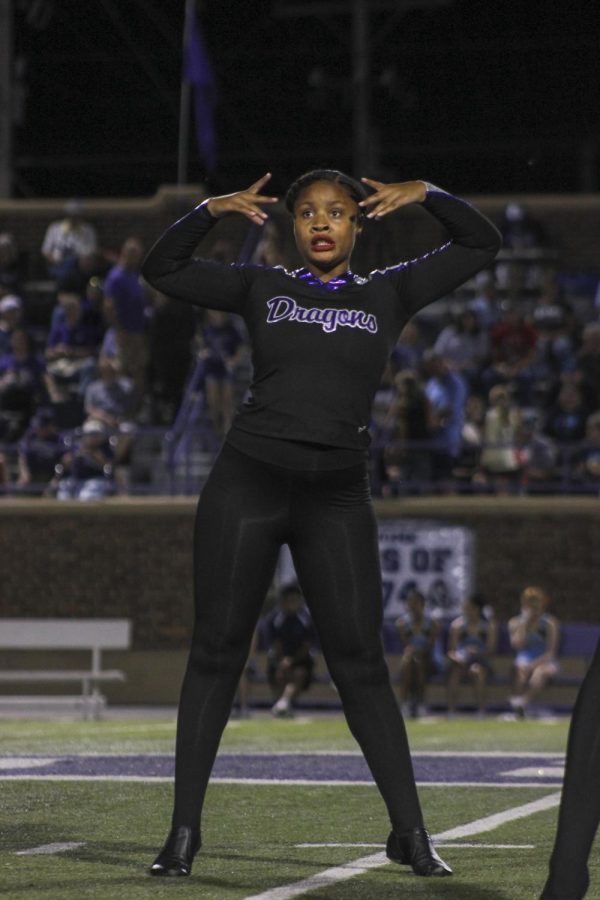 Junior Isis Thomas dances on the halftime field during the halftime show on Oct. 19