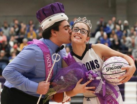 Junior Chris Saman kisses junior Natalie Talent for the Winter homecoming ceremony.