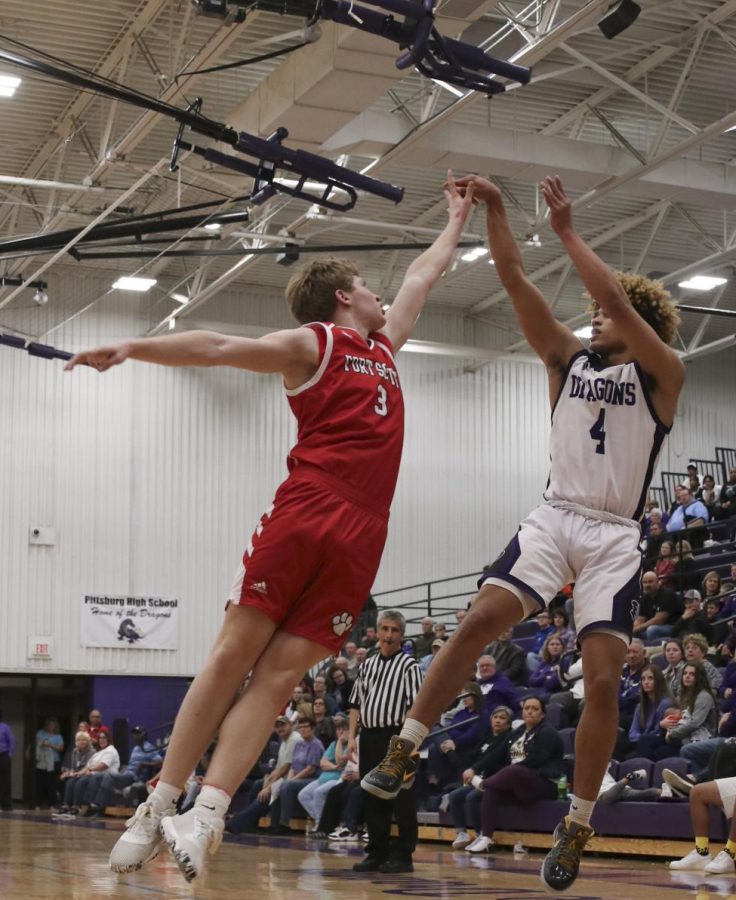 Senior Gavyn Elkamil rises up over a defender for a jumpshot.