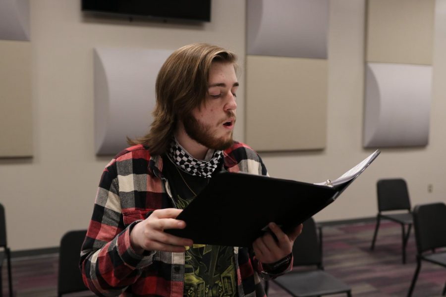 Senior Dallas Cox rehearses his solo for vocal music director Susan Laushman. Cox selected a Russian folk song.