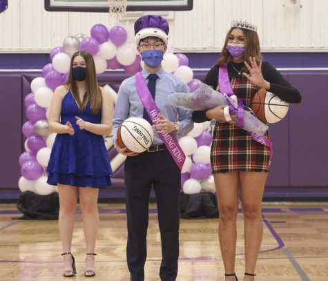 Prom king Joseph Lee (12) talks to prom queen Jaya Minniefield (12).
