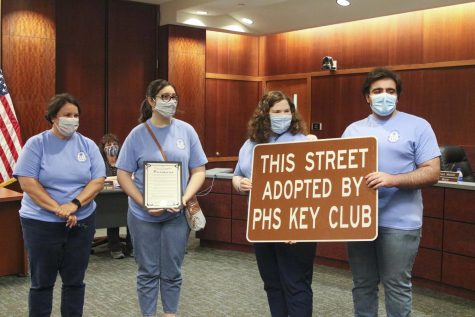 Key Club Advisor Kristin Thomas stands with club officers Corin Cooper, Elliot DeGruson, and Chris Saman to accept an adopted highway from the County Commissioner's office.
