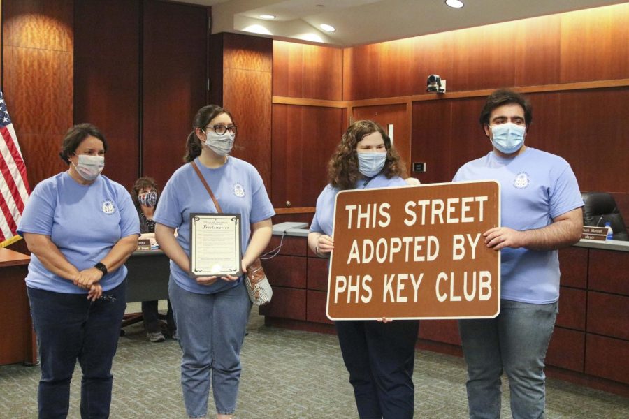 Key Club Advisor Kristin Thomas stands with club officers Corin Cooper, Elliot DeGruson, and Chris Saman to accept an adopted highway from the County Commissioners office.