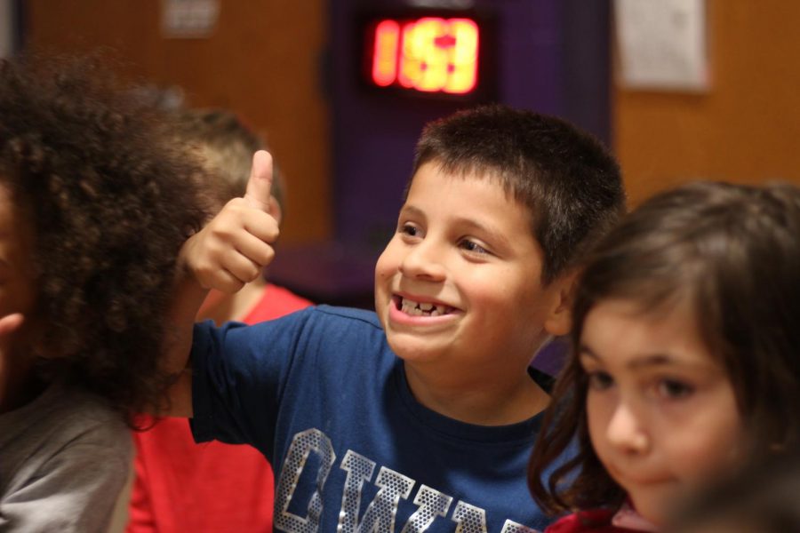 Elementary students pose for a picture before leaving their private lunch.