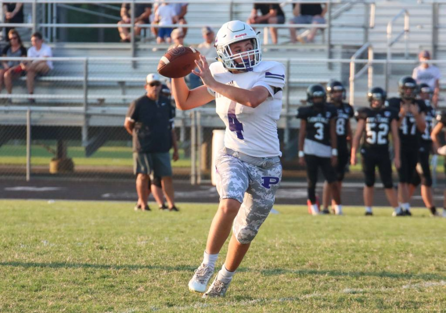 Freshman Carsen Nickelson throws the ball to his teammate. On September 14, the Pittsburg Dragons played against the Frontenac Raiders. The dragons succeed to defeat the Raiders 22 to 14. 