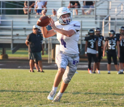 Freshman Carsen Nickelson throws the ball to his teammate. On September 14, the Pittsburg Dragons played against the Frontenac Raiders. The dragons succeed to defeat the Raiders 22 to 14. 