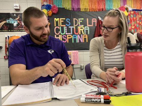 Spanish teacher Angela Pallarés works with health teacher Jose Speer to improve his Spanish writing. 