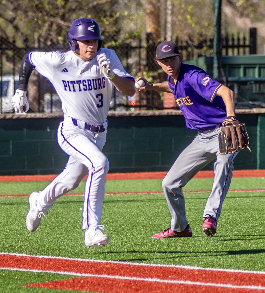 After a sacrifice bunt, junior Jett Burgess races to first base to beat the pitcher from throwing him out. 