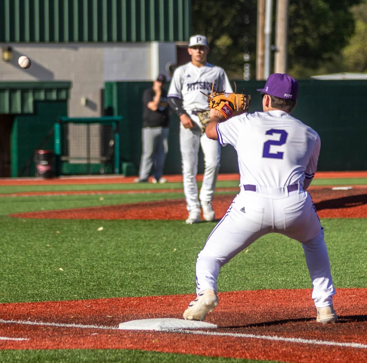 Senior Grant ODoherty catches a throw from sophomore and third basemen Cole Hayden to get the runner out. 