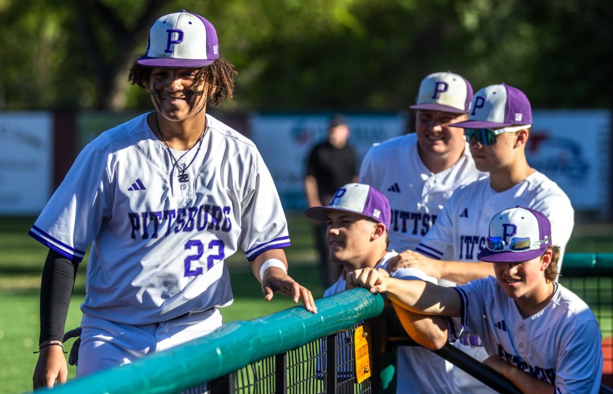 After interactions with fellow teammates, junior Jaden Whetzell walks away to watch the Pittsburg batter. 