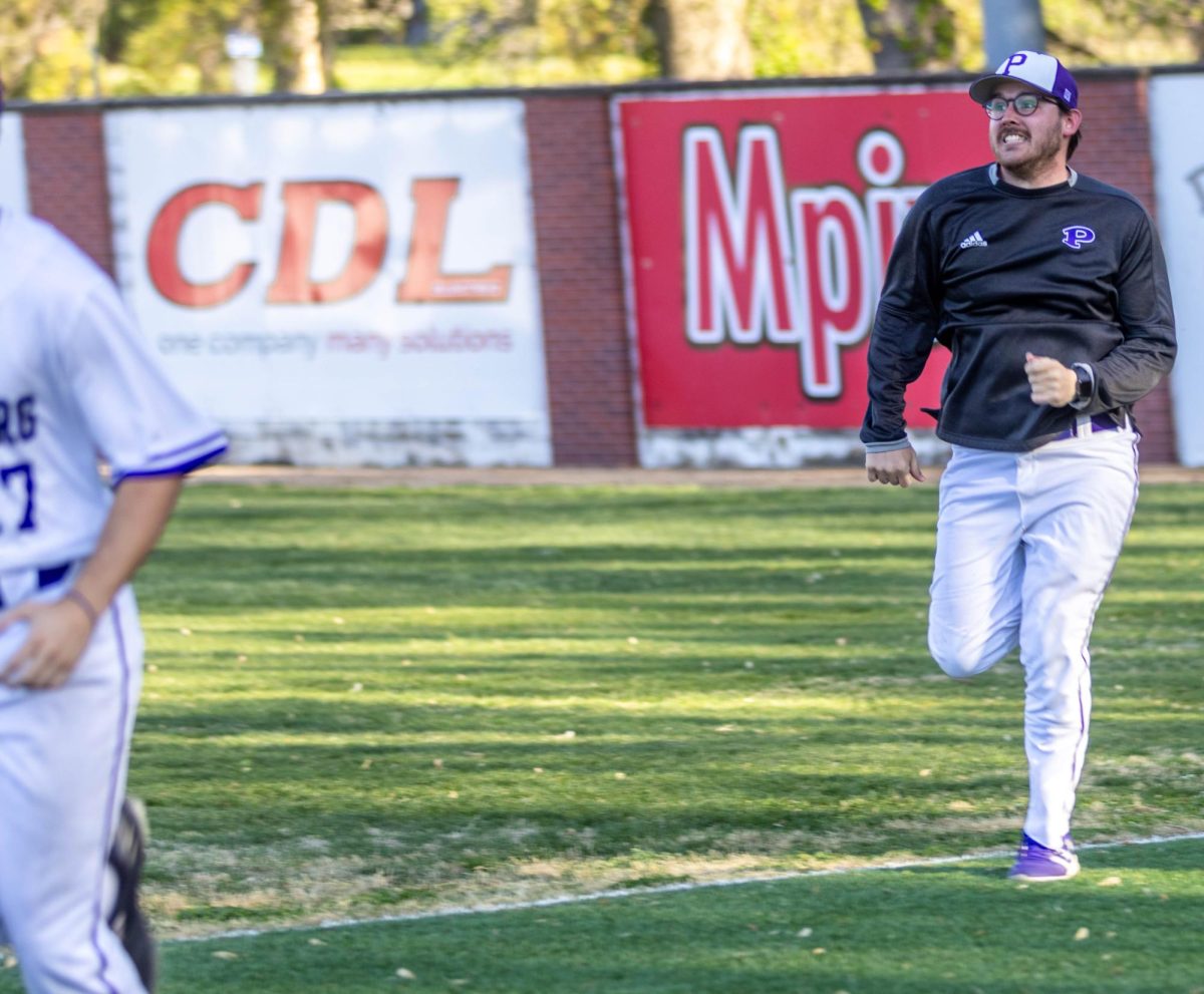 Between the inning, Coach Dalton Gromer tried to race the non-starting Varsity players from the fence back to the dugout. 