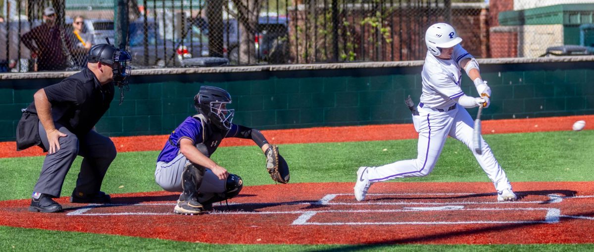 Senior Parker Johnston hits a fastball in the left-field gap. 