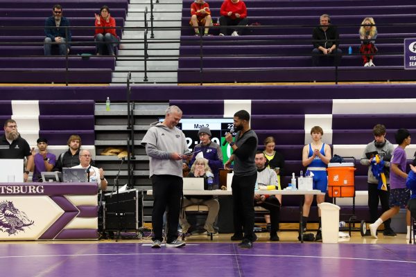 Jeff Staley receives Administrator of the Year Award during wrestling meet.