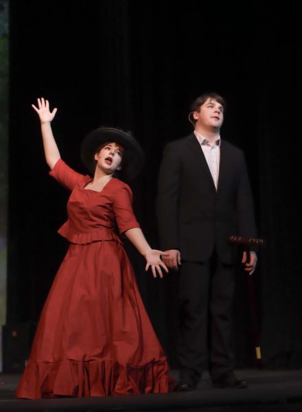 Senior Chloe Costello and sophomore Townes Sullivan perform in The Unsinkable Molly Brown in the direction of his mom, Breanna Clark. “I definitely have a more accessible gateway into the world of theater because of my mom,” Townes Sullivan said. “However, during auditions, my mother has a panel of judges and refuses to suggest us for any role. She tries her hardest to make it balanced, but I still get benefits.” 