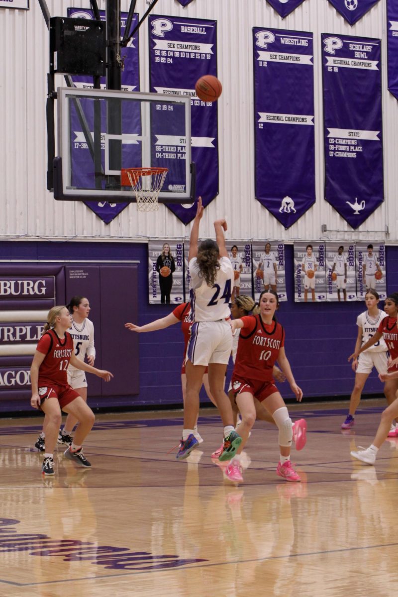 Freshman Kyndall Elkamil knocks down a three-pointer to extend the JV girls’ lead to 10 in the second quarter against Fort Scott.