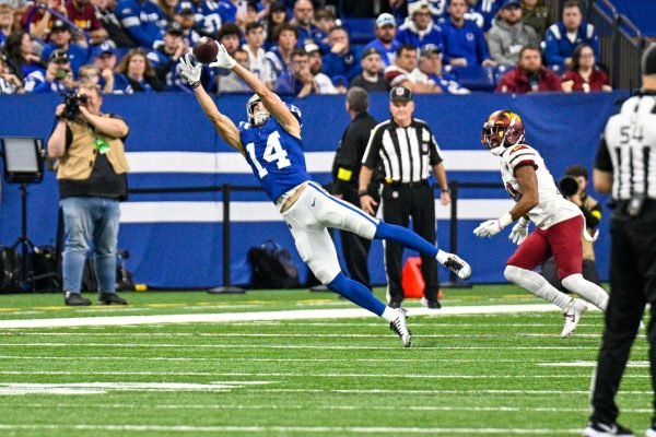 Colts Wide Receiver Extends out to Catch a pass against the Washington Commanders In Lucas Oil stadium. Alec Pierce Commanders vs Colts OCT2022 by All Pro Reel is licensed under CC-BY-SA-2.0..