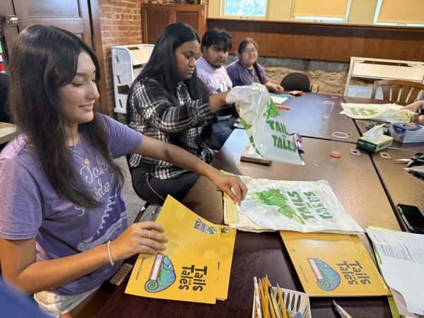 Freshman Stephanie Bonilla, Senior Mya Anthony, Senior Jonathan Sipaque de Leon, and Sophomore Angeline Bautista are volunteering at the Pittsburg Public Library for the volunteens program on Sept. 23, 2025. They're putting together kits for the upcoming youth projects and programs.