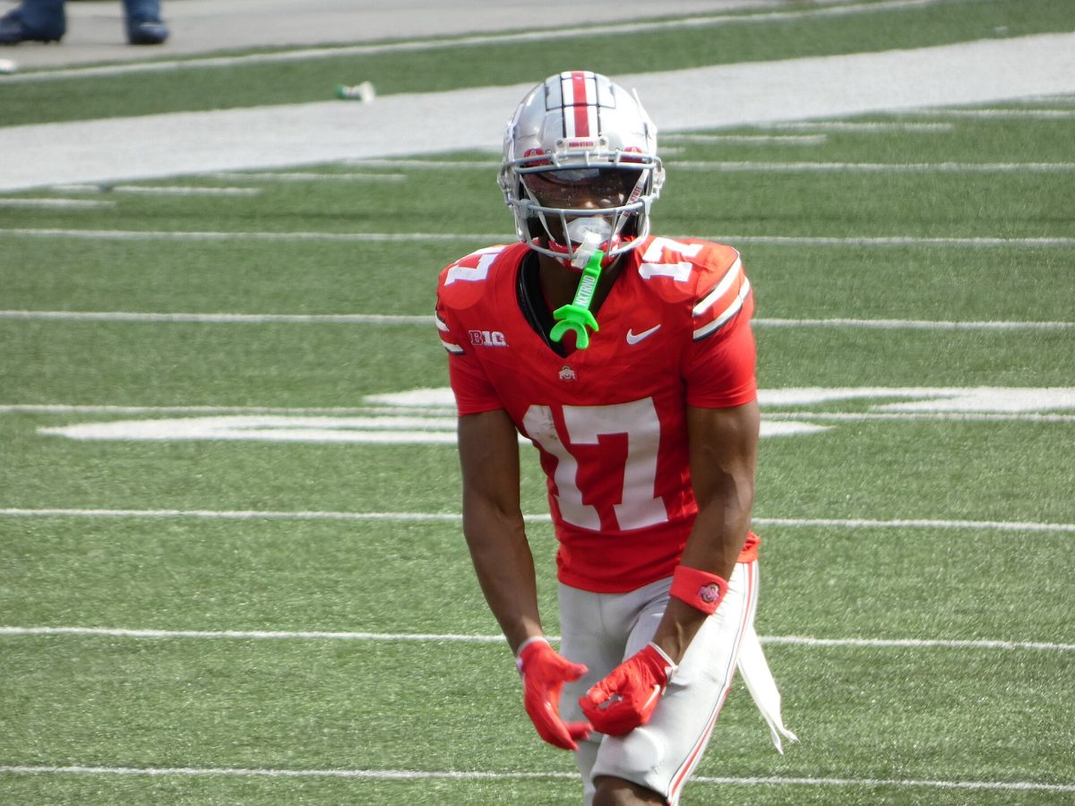 Ohio State wide receiver Carnell Tate lines up in a game against the Akron Zips in Ohio Stadium. Carnell_Tate_2024.jpg by Ruralexpat is licensed under CC-Zero.
